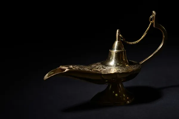 Magic lamp isolated on black Royalty Free Stock Images