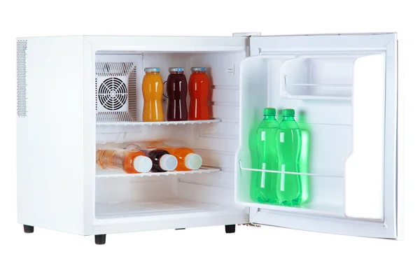 Mini fridge full of bottles of juice, soda and fruit — Stock Photo, Image