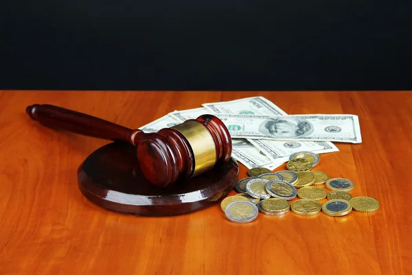 Gavel and money on table on black background — Stock Photo, Image