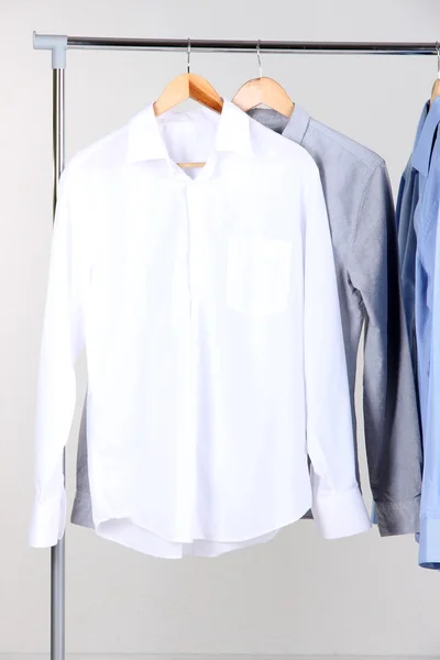 Office male clothes on hangers, on gray background — Stock Photo, Image