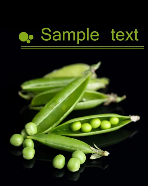 Fresh green peas isolated on black background — Stock Photo, Image
