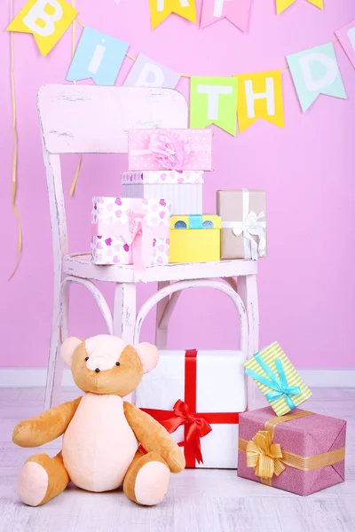 Many birthday gifts in room — Stock Photo, Image