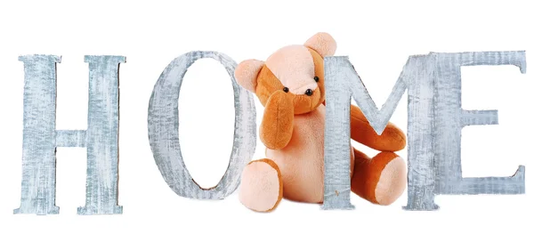 Decorative letters forming word HOME with teddy bear isolated on white — Stock Photo, Image