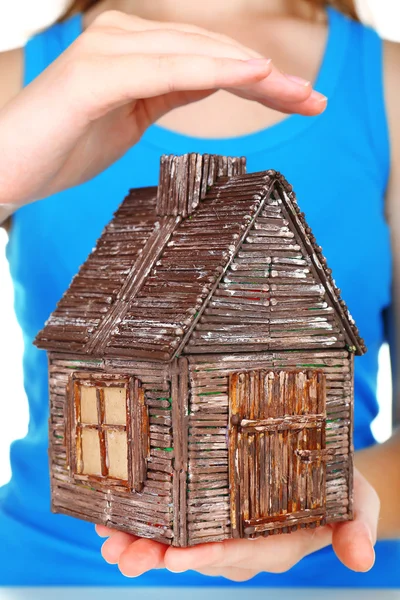 Small wooden house in hands, close up — Stock Photo, Image