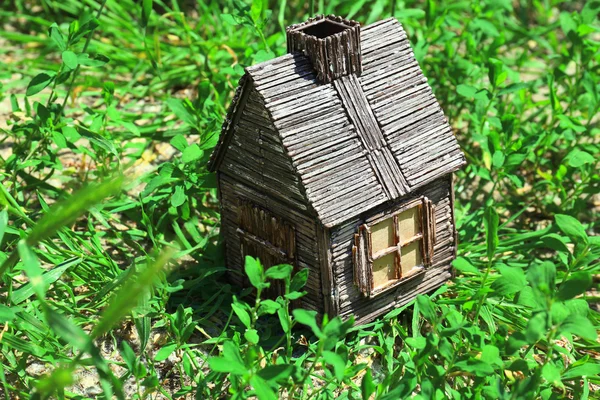 Small wooden house on grass, outdoors — Stock Photo, Image