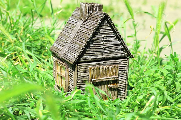 Small wooden house on grass, outdoors — Stock Photo, Image