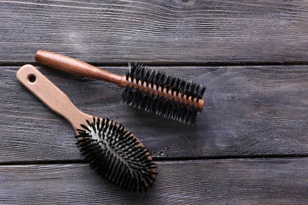 Wooden hairbrushes on wooden background — Stock Photo, Image
