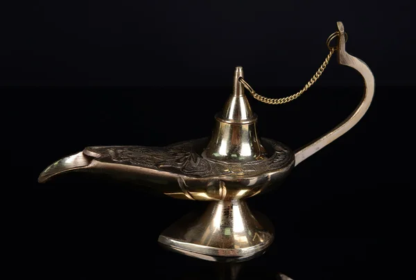 Magic lamp isolated on black Stock Image