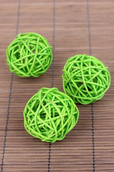 Wicker bamboo balls on bamboo mat — Stock Photo, Image