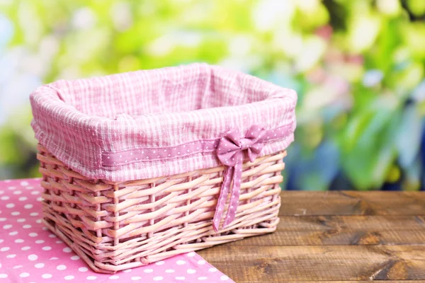 Empty wicker basket on wooden table — Stock Photo, Image