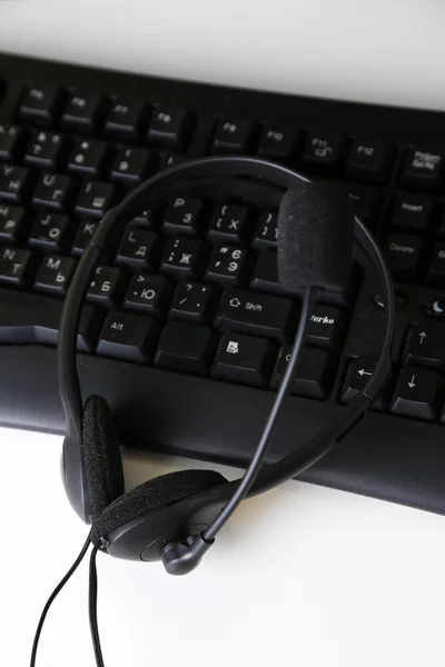 Headphone and keyboard close-up — Stock Photo, Image