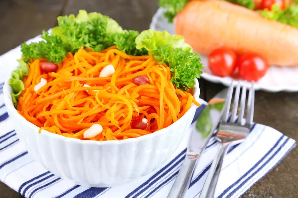 Carrot salad on plate on napkin — Stock Photo, Image