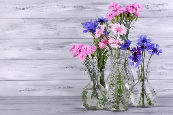 Beautiful summer flowers in vases — Stock Photo, Image