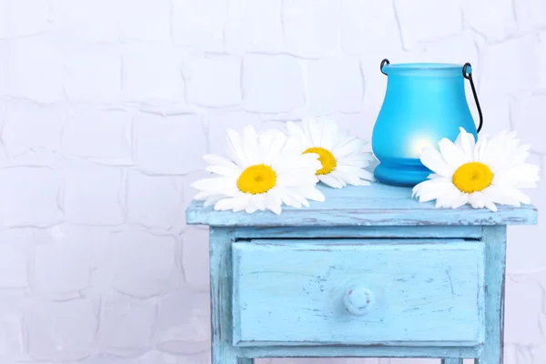 Bright icon-lamp with flowers on wooden stand — Stock Photo, Image