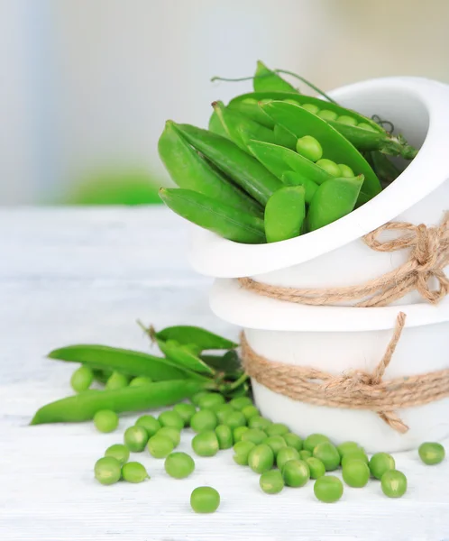 Fresh green peas in bowl — Stock Photo, Image