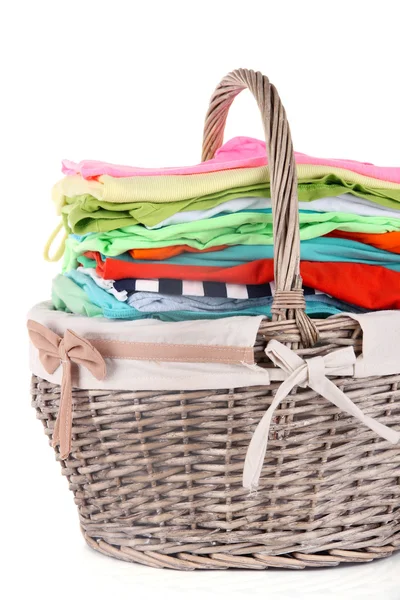 Bright clothes in laundry basket — Stock Photo, Image