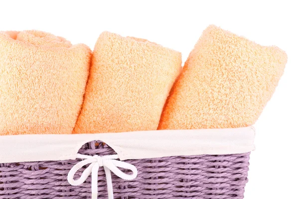 Color towels in wicket basket — Stock Photo, Image