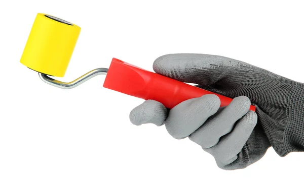 Bright paint roller in hand — Stock Photo, Image