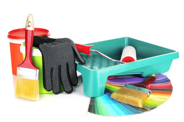 Plastic bucket with paint, roller, brushes and bright palette of colors — Stock Photo, Image