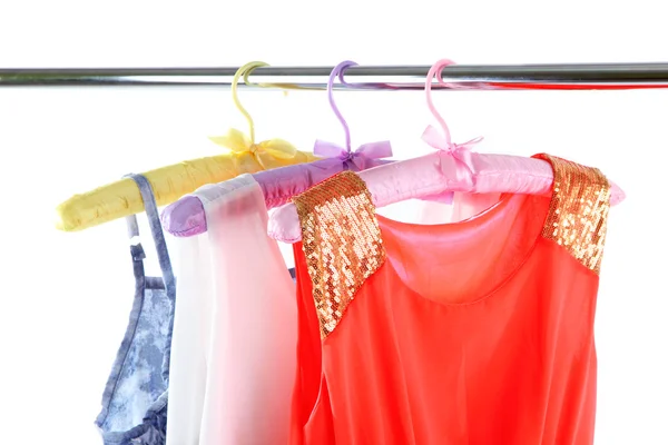 Beautiful dresses hanging on hangers — Stock Photo, Image