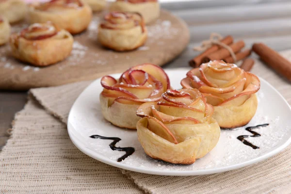 Tasty  puff pastry with apple shaped roses on plate — Stock Photo, Image