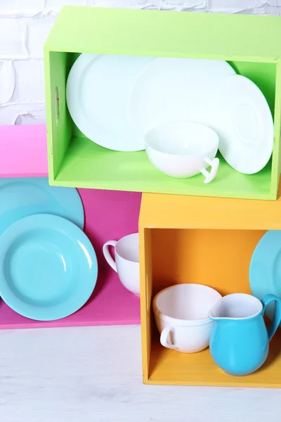 Beautiful  bright shelves and boxes with tableware — Stock Photo, Image