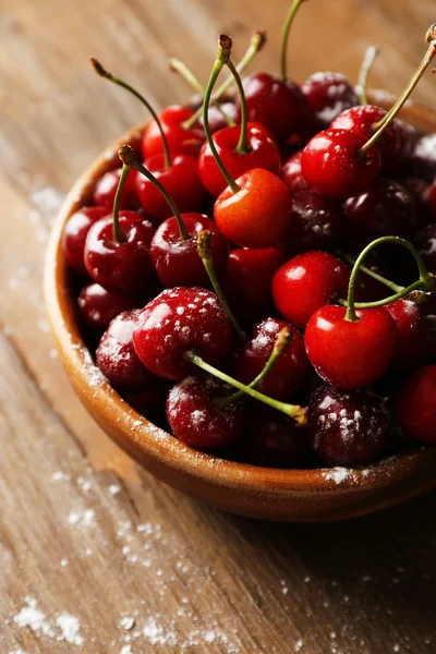 Sweet cherries on wooden table — Stock Photo, Image