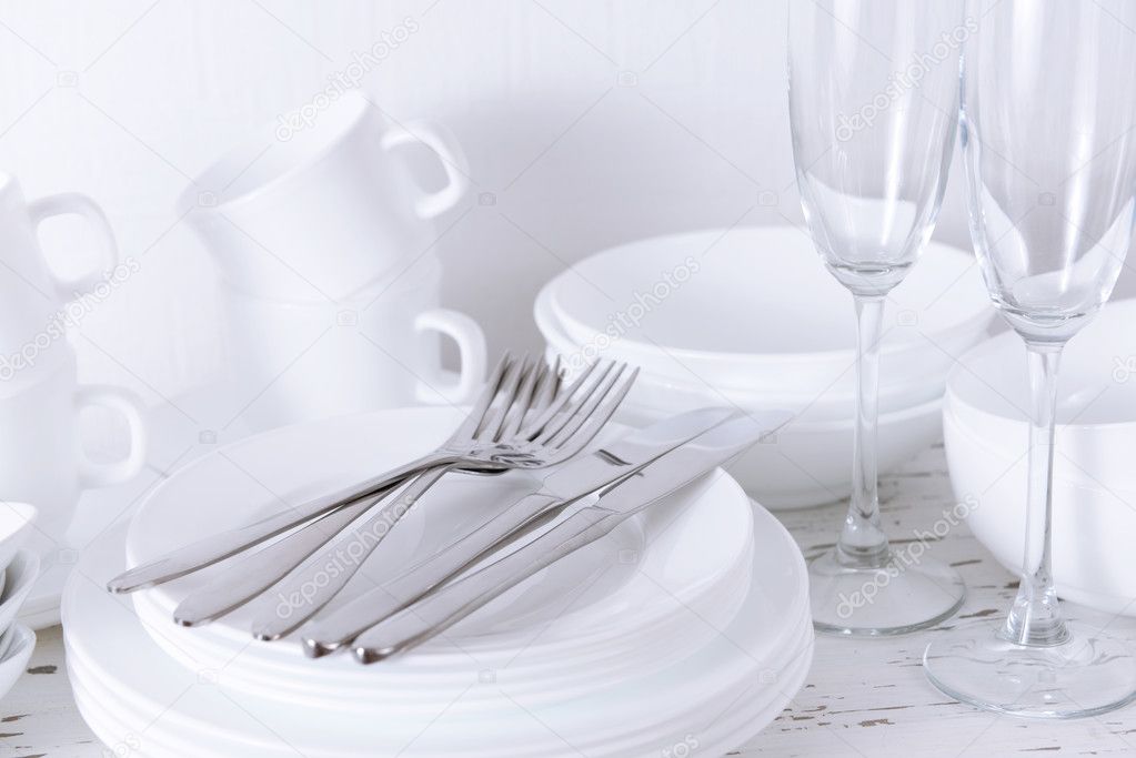 Set of white dishes on table