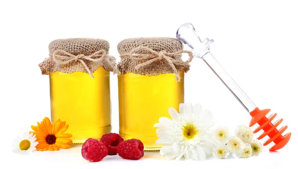 Jar full of delicious fresh honey and wild flowers, isolated on white — Stock Photo, Image