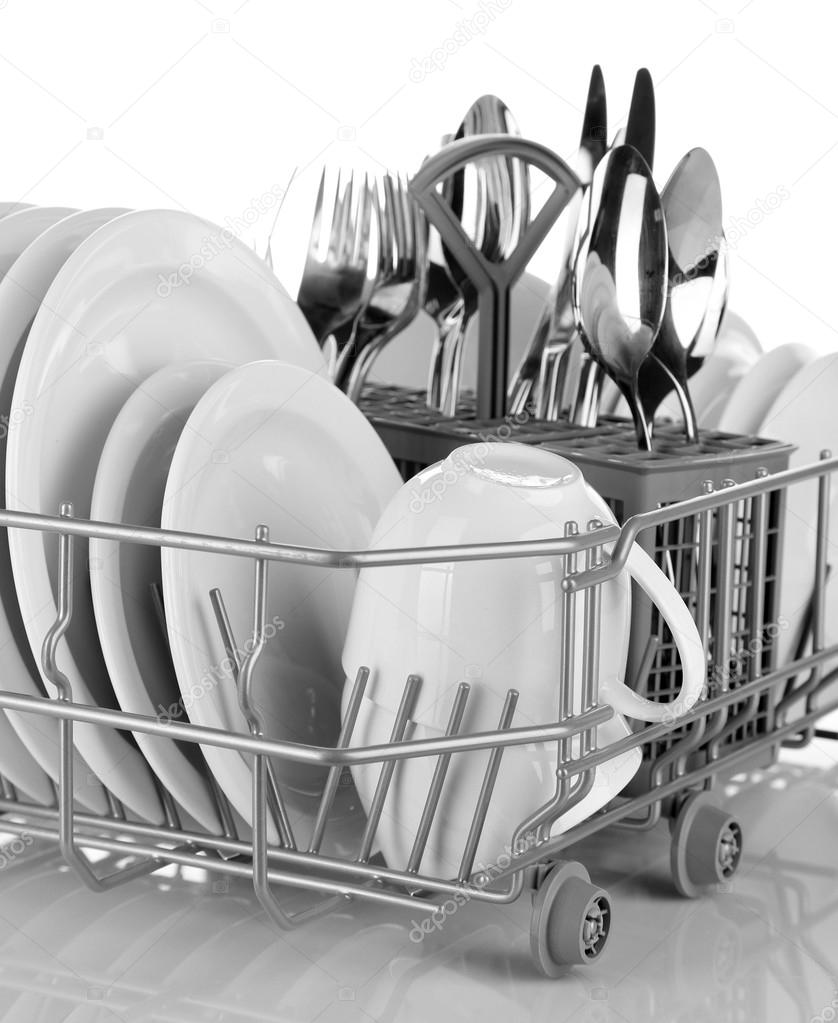 Clean dishes drying on metal dish rack, isolated on white Stock Photo