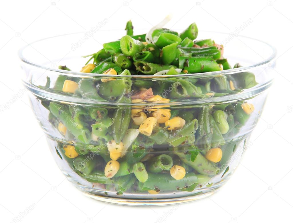 Salad with green beans, ham and  corn in glass bowl, isolated on white