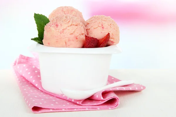 Tasty ice cream scoops in bowl, on table — Stock Photo, Image