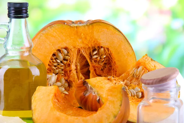 Cut pumpkin with ingredients for cooking — Stock Photo, Image