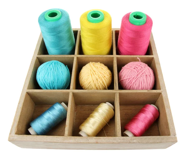 Multicolored skeins of thread in wooden box — Stock Photo, Image