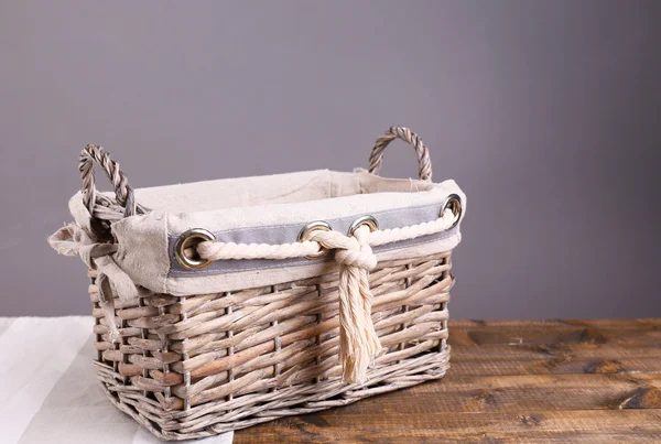 Empty wicker basket on wooden table — Stock Photo, Image