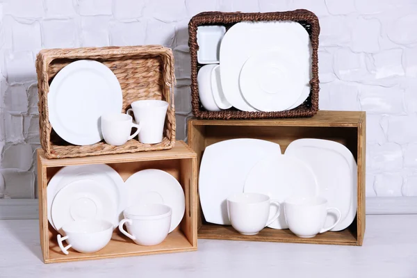 Shelves and boxes with tableware — Stock Photo, Image