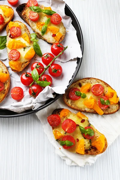 Tasty bruschetta with tomatoes — Stock Photo, Image