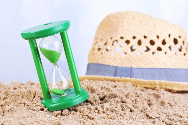 Hourglass in sand — Stock Photo, Image
