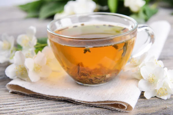 Cup of tea with jasmine on table — Stock Photo, Image