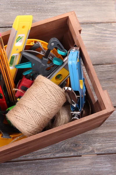 Wooden box with different tools — Stock Photo, Image