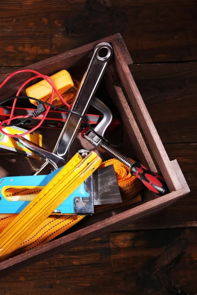 Wooden box with different tools — Stock Photo, Image