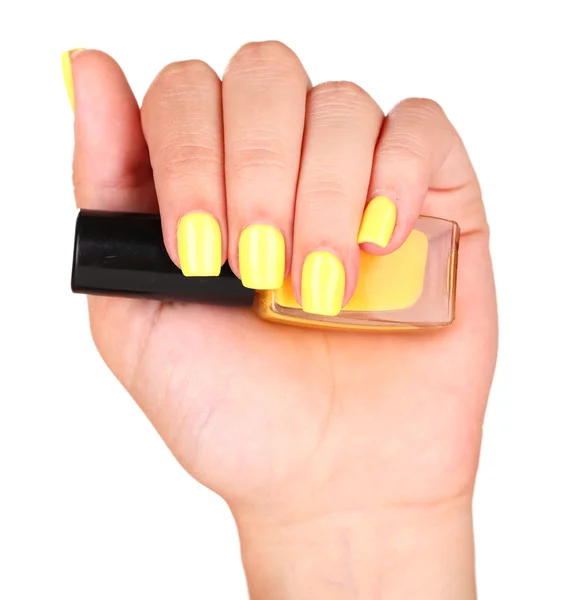 Female hand with stylish colorful nails holding bottle with nail polish — Stock Photo, Image