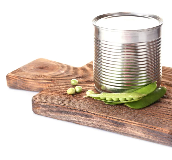 Fresh peas and tin on wooden board, isolated on white — Stock Photo, Image