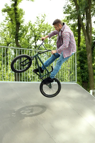 Boy jumping with his BMX Bike — Stock Photo, Image