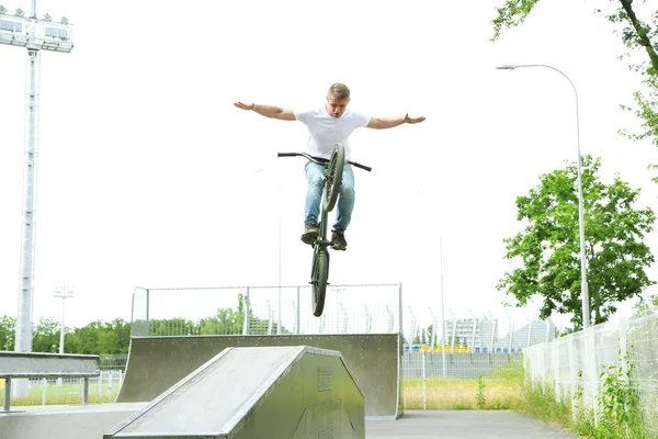 Boy jumping with his BMX Bike — Stock Photo, Image