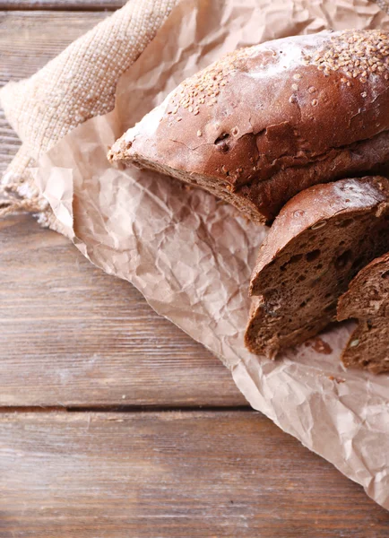 Fresh bread on wooden background — Stock Photo, Image