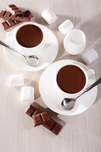 Cups of hot chocolate on table, close up — Stock Photo, Image