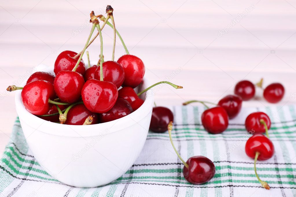 Ripe sweet cherries in bowl