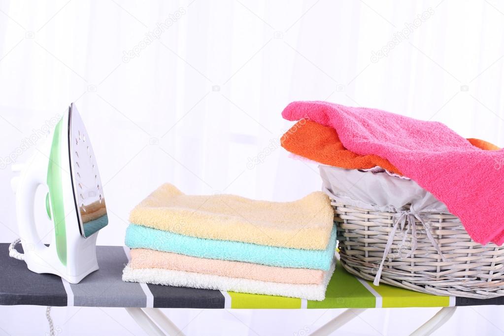 Basket with laundry and ironing board