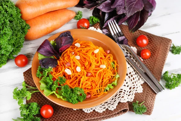 Carrot salad on plate on napkin — Stock Photo, Image